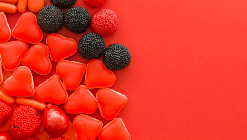 Berries Bonbons at the Red Background