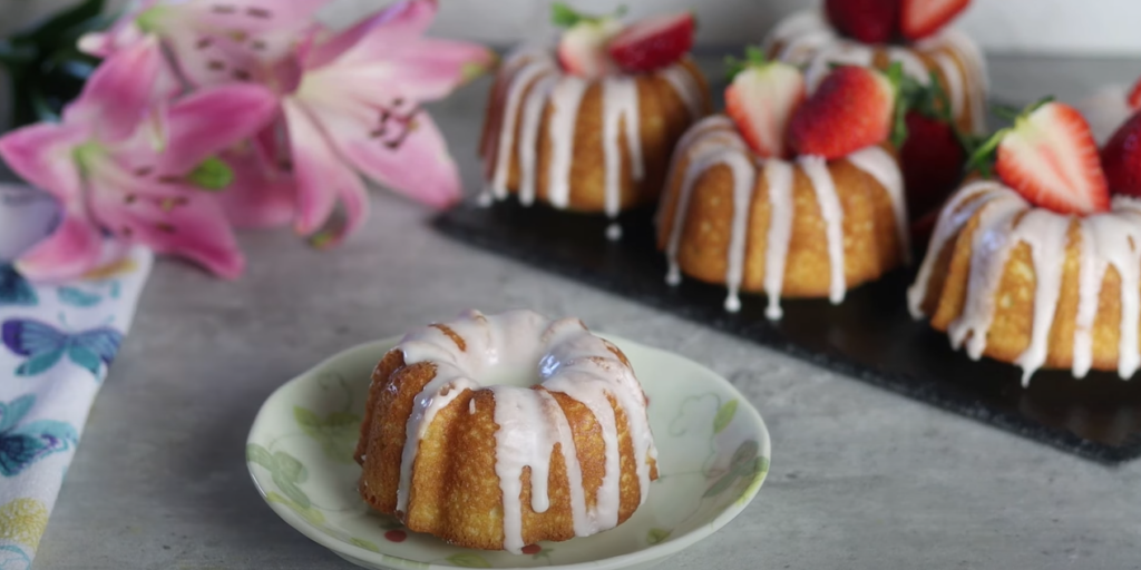 Classic Vanilla Bliss on a plate, with another in the background topped with strawberries