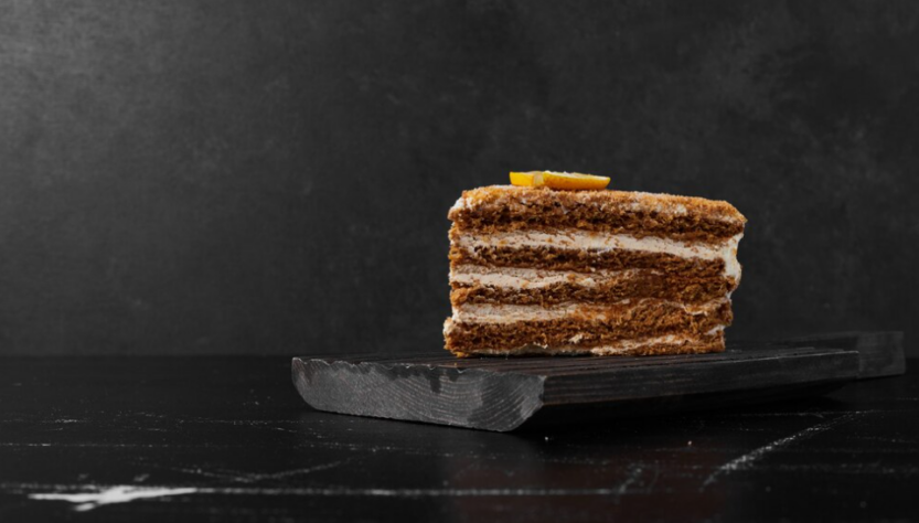 cake on black stone on a black marble table